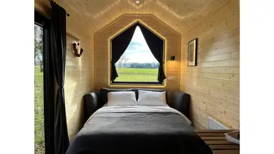 Ein Bett oder Betten in einem Zimmer der Unterkunft Lisi Grun Tiny House by Tiny Away