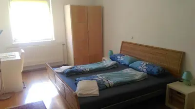 Ein Bett oder Betten in einem Zimmer der Unterkunft Rooming Green Weyregg