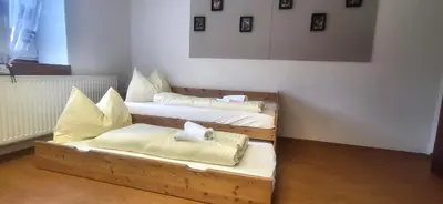 Ein Bett oder Betten in einem Zimmer der Unterkunft Hoamathaus II by Alpenidyll Apartments