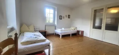Ein Bett oder Betten in einem Zimmer der Unterkunft Hoamathaus II by Alpenidyll Apartments