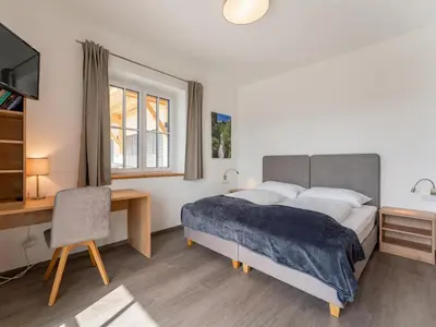 Ein Bett oder Betten in einem Zimmer der Unterkunft Lärchenhof Top 101