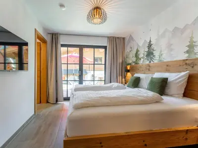 Ein Bett oder Betten in einem Zimmer der Unterkunft Wagrainer TauernLodge 42D