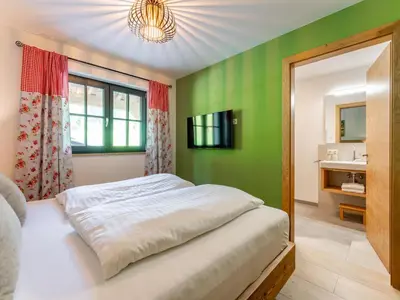 Ein Bett oder Betten in einem Zimmer der Unterkunft Wagrainer TauernLodge 42D