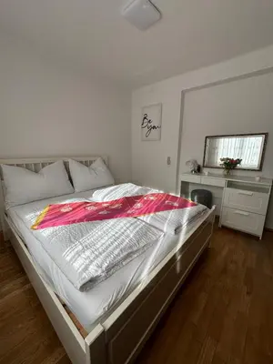 Ein Bett oder Betten in einem Zimmer der Unterkunft Wohnung See- und Bergnähe