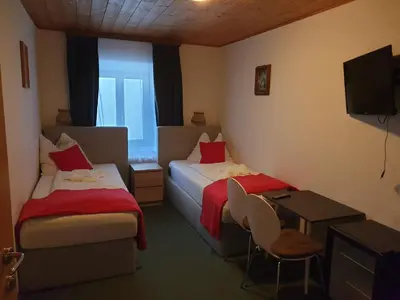 Ein Bett oder Betten in einem Zimmer der Unterkunft Weisses Rössel-Cavallo Bianco