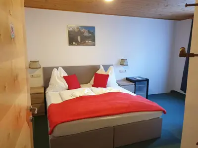 Ein Bett oder Betten in einem Zimmer der Unterkunft Weisses Rössel-Cavallo Bianco