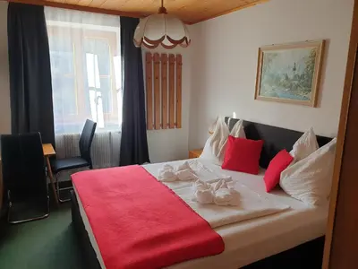 Ein Bett oder Betten in einem Zimmer der Unterkunft Weisses Rössel-Cavallo Bianco