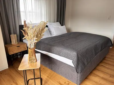 Ein Bett oder Betten in einem Zimmer der Unterkunft Pension Stöllinger mit Traumausblick