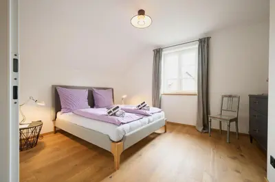 Ein Bett oder Betten in einem Zimmer der Unterkunft Ferienwohnungen Haus Rose Marie - Your Austrian Home