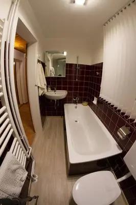 Ein Sitzbereich in der Unterkunft Grimmingapartment Maier