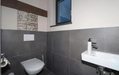 Ein Badezimmer in der Unterkunft Ferienhaus Mit Sauna