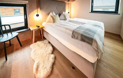 Ein Bett oder Betten in einem Zimmer der Unterkunft Ferienhaus Mit Sauna