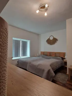 Ein Bett oder Betten in einem Zimmer der Unterkunft Haus Kampl - Appartement Ödensee