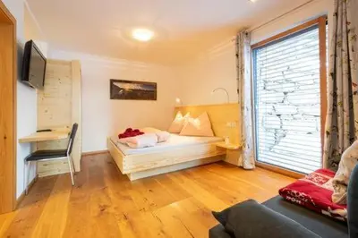 Ein Bett oder Betten in einem Zimmer der Unterkunft Ferienwohnung Hinterlehen