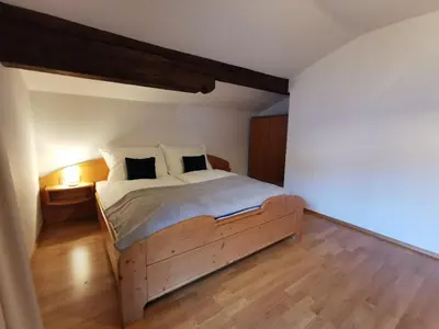 Ein Bett oder Betten in einem Zimmer der Unterkunft Haus Comodo