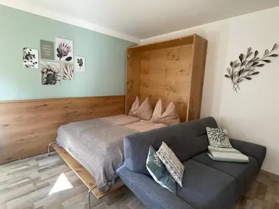 Ein Sitzbereich in der Unterkunft Haus Füsslmühle