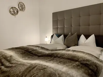 Ein Bett oder Betten in einem Zimmer der Unterkunft Almlodge Flachau