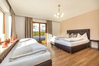 Ein Bett oder Betten in einem Zimmer der Unterkunft Herzerl-Chalet Appartements