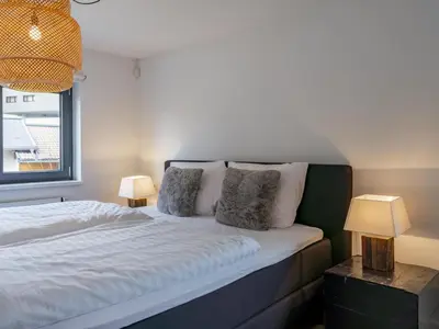 Ein Bett oder Betten in einem Zimmer der Unterkunft Mozart Lodge