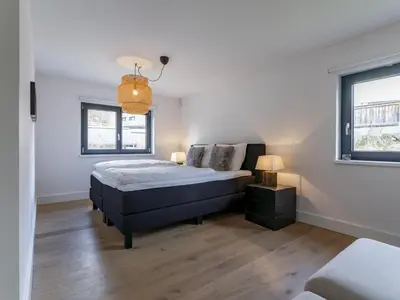 Ein Bett oder Betten in einem Zimmer der Unterkunft Mozart Lodge