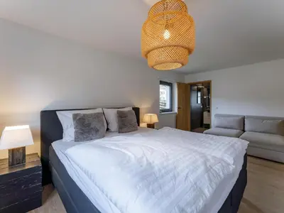 Ein Bett oder Betten in einem Zimmer der Unterkunft Mozart Lodge