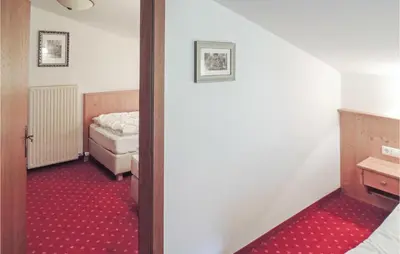Ein Bett oder Betten in einem Zimmer der Unterkunft Schoene Ferienwohnung Flachau