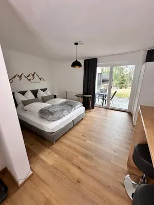 Ein Bett oder Betten in einem Zimmer der Unterkunft Grimming Lodge Tauplitz
