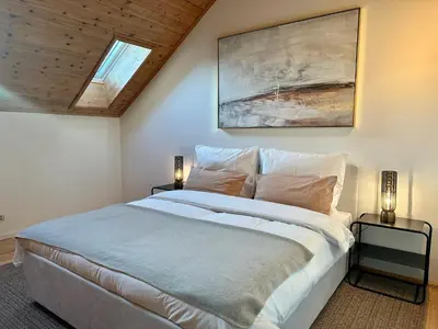 Ein Bett oder Betten in einem Zimmer der Unterkunft 17er Apartment mit Sauna und Garage
