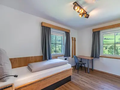 Ein Bett oder Betten in einem Zimmer der Unterkunft Apartment Grimming by Interhome