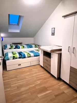 Ein Bett oder Betten in einem Zimmer der Unterkunft Moderne, Ferienwohnung mit Seeblick, near Hallstatt