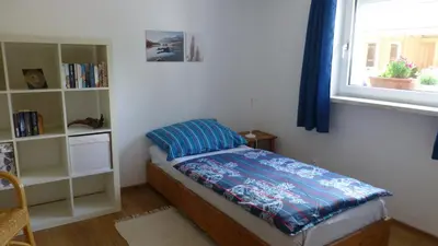Ein Bett oder Betten in einem Zimmer der Unterkunft Ferienwohnung Rabennest