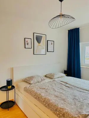 Ein Bett oder Betten in einem Zimmer der Unterkunft Zentrale Wohnung mit Alpenblick