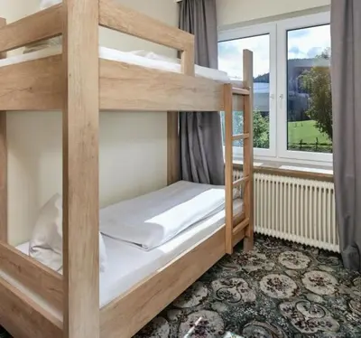 Ein Bett oder Betten in einem Zimmer der Unterkunft Hotel Bergglück
