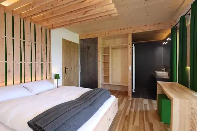 Ein Bett oder Betten in einem Zimmer der Unterkunft Chalet Alm Planai