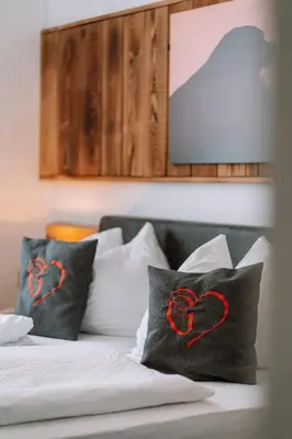 Ein Bett oder Betten in einem Zimmer der Unterkunft Hotel Garni Familie Gruber