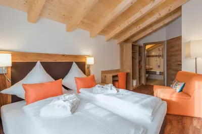 Ein Bett oder Betten in einem Zimmer der Unterkunft Chalets AurAlpin