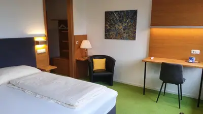 Ein Bett oder Betten in einem Zimmer der Unterkunft Hotel & Fitness Castello