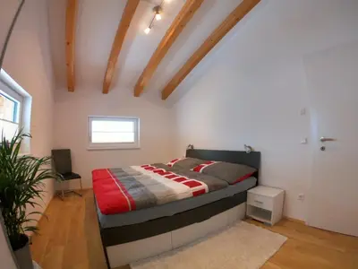 Ein Bett oder Betten in einem Zimmer der Unterkunft Arlerhof