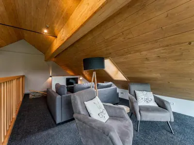 Ein Sitzbereich in der Unterkunft Alpinn Wellness 1
