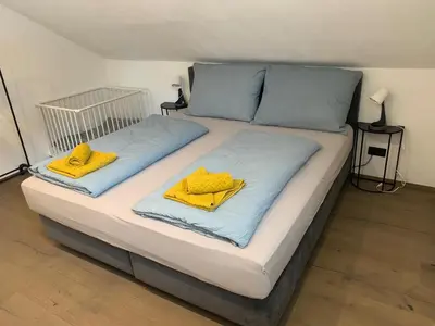 Ein Bett oder Betten in einem Zimmer der Unterkunft Idyllische Suite in Zentrumsnähe mit Parkplatz Top 2