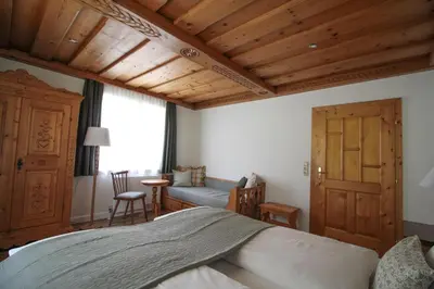 Ein Bett oder Betten in einem Zimmer der Unterkunft Frieda's Platzl