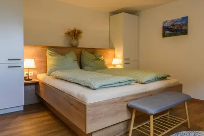 Ein Bett oder Betten in einem Zimmer der Unterkunft Ferienwohnung Werner Pucher EG