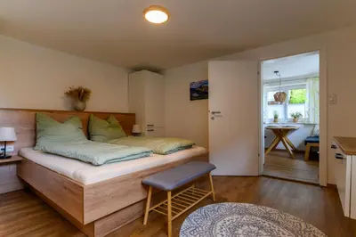 Ein Bett oder Betten in einem Zimmer der Unterkunft Ferienwohnung Werner Pucher EG