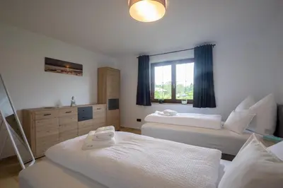 Ein Bett oder Betten in einem Zimmer der Unterkunft Jubiläum Apartment