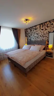 Ein Bett oder Betten in einem Zimmer der Unterkunft Noor Lux Apartments