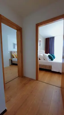 Ein Bett oder Betten in einem Zimmer der Unterkunft Noor Lux Apartments