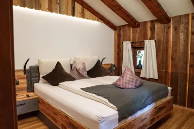 Ein Bett oder Betten in einem Zimmer der Unterkunft Chalet Aignerhof