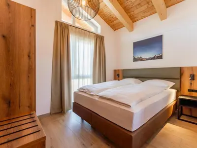 Ein Bett oder Betten in einem Zimmer der Unterkunft Grebenzen Lodge 51