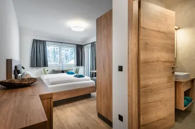 Ein Bett oder Betten in einem Zimmer der Unterkunft T-Lodge Zauchensee