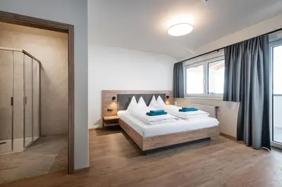 Ein Bett oder Betten in einem Zimmer der Unterkunft T-Lodge Zauchensee